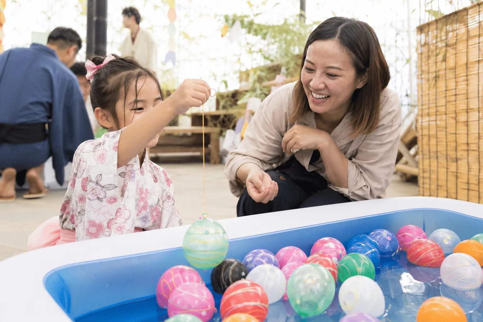 A child enjoying Japanese yo-yo fishing